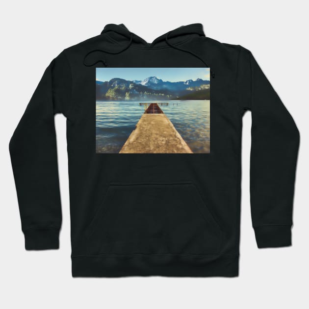 sea jetty and mountain view in winter Hoodie by stuartchard